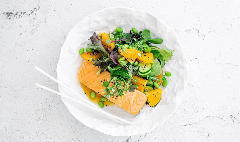 Steamed Salmon scented  with orange aromas, served  with fresh greens & edamame